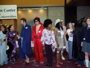 The costume contest at the JCMU Halloween party in 2003. The student in the red suit won that year for his Hellvis costume, a cross between Elvis and
